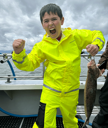 Boy Holding A Fish
